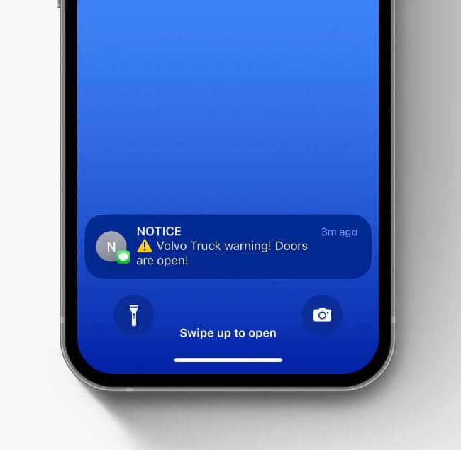 Mobile app notification saying Volvo truck doors are open, preview on locked screen.