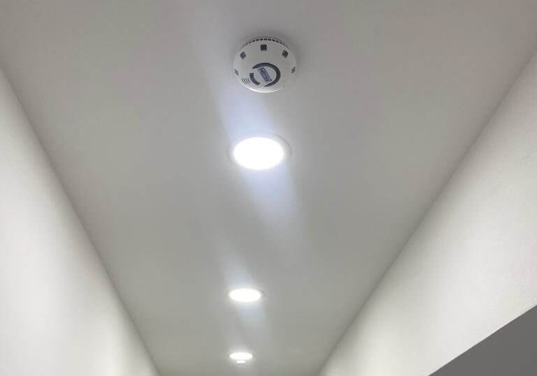 smoke sensor on ceiling in hallway